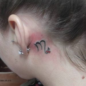 Mini Scorpio Symbol with Bow Behind the Ear Tattoo