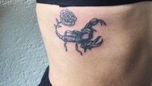 Scorpio Scorpion and Rose Rib Tattoo