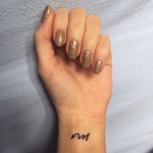 Minimalist Scorpio Symbol Wrist Tattoo