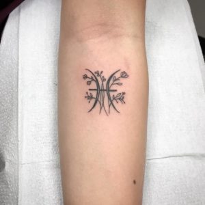 Pisces Symbol and Flower Forearm Tattoo