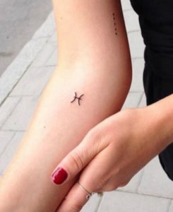 Mini Pisces Symbol Forearm Tattoo