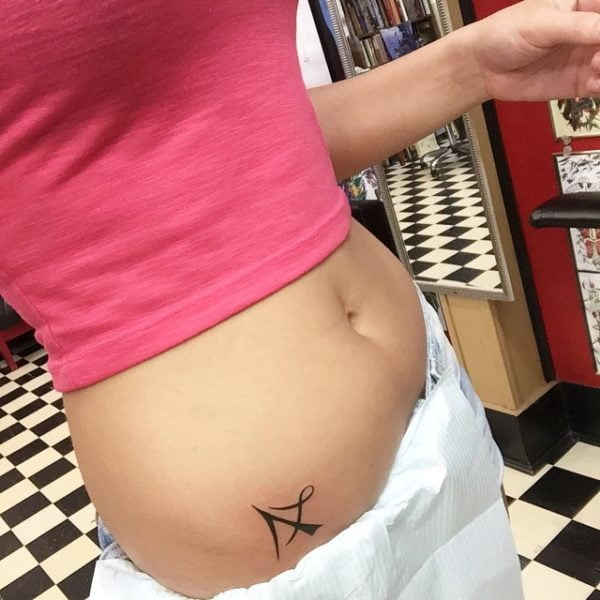 arrow tattoo on hip