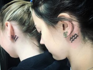 Aquarius Symbol Behind the Ear Tattoo
