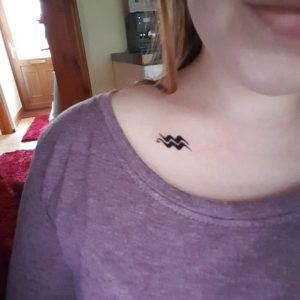 Aquarius Sign Collarbone Tattoo