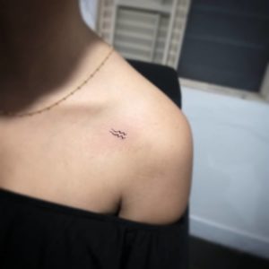 Mini Aquarius Sign Collarbone Tattoo