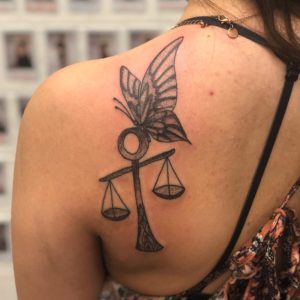 Libra Butterfly on Scales Shoulder Blade Tattoo