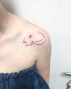 Abstract Black and Gray Sleeping Cat Collarbone Tattoo