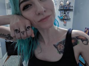 Cat Eyes and Nose Finger Tattoo