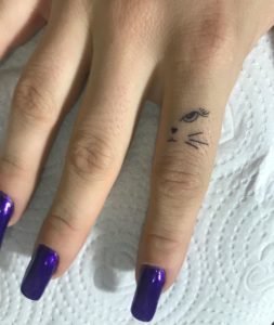 Cat Eye and Whiskers Finger Tattoo