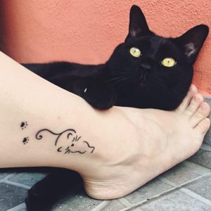 Abstract Black Cat Ankle Tattoo
