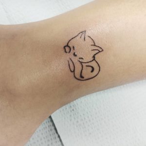 Mini Sleeping Cat Ankle Tattoo