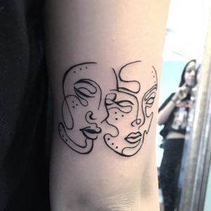 Zodiac Gemini Faces Line Art Upper Arm Tattoo