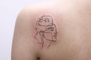 Gemini Twin Faces Single Needle Shoulder Blade Tattoo