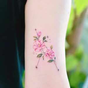 Cancer Flower and Constellation Bicep Tattoo