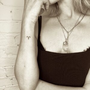 Tiny Aries Symbol Wrist Tattoo