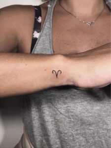 Mini Aries Symbol Wrist Tattoo