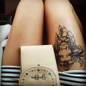 Taurus Bull and Feathers Thigh Tattoo