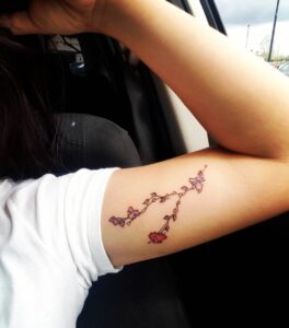 Taurus Constellation with Flowers Bicep Tattoo