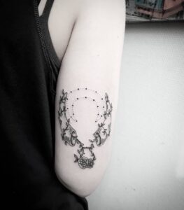 Taurus Horns and Vines Arm Tattoo