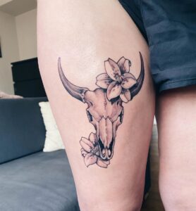 Taurus Skull and Flowers Thigh Tattoo