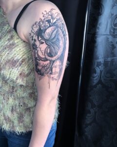 Aries Girl with Horns Shoulder Tattoo