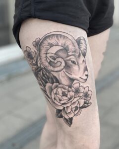 Aries Ram Head and Flowers Thigh Tattoo