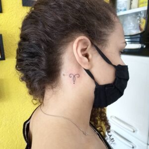 Aries Symbol with Dot Behind Ear Tattoo