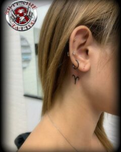 Aries Symbol Behind the Ear Tattoo