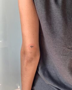 Mini Aries Symbol Elbow Tattoo