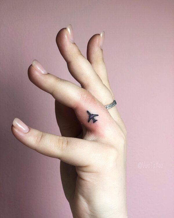 Airplane Outline Finger Tattoo