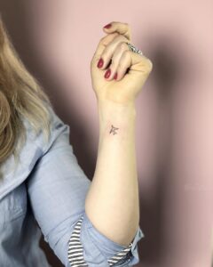 Mini Airplane Wrist Tattoo