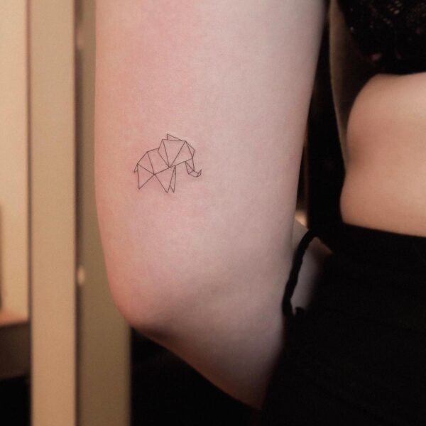 Paper Elephant Tattoo On Upper Back