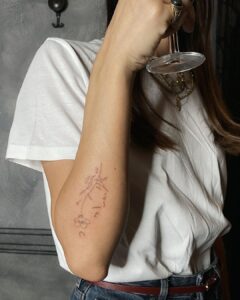 Face And Flower Forearm Tattoo