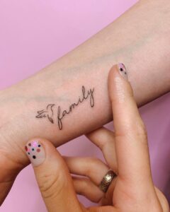 Family Script Wrist Tattoo