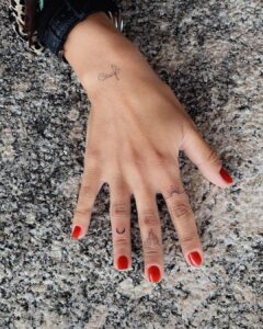 Crescent Moon and Flames Finger Tattoo