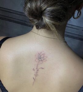 Rose And Face Spine Tattoo