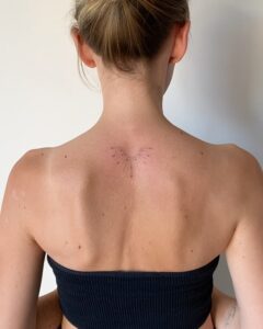 Half Sun Upper Back Tattoo