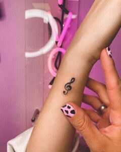 Treble Clef Wrist Tattoo