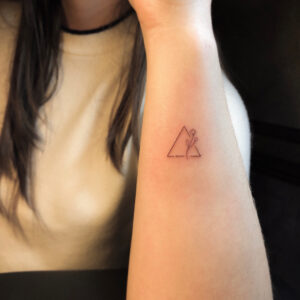 Triangle And Flower Wrist Tattoo