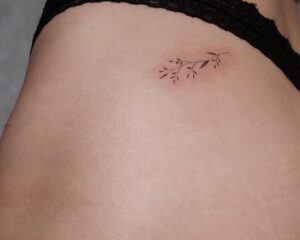 Fine Line Vine Hip Tattoo
