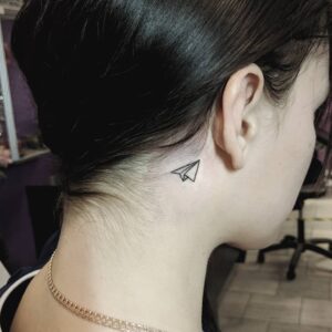 Paper Airplane Behind the Ear Tattoo