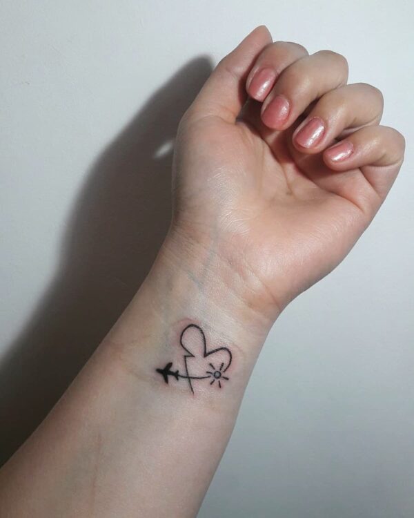 Airplane and Heart Wrist Tattoo