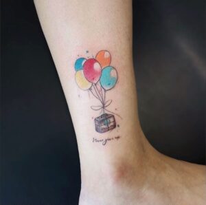 Balloon and Luggage Ankle Tattoo
