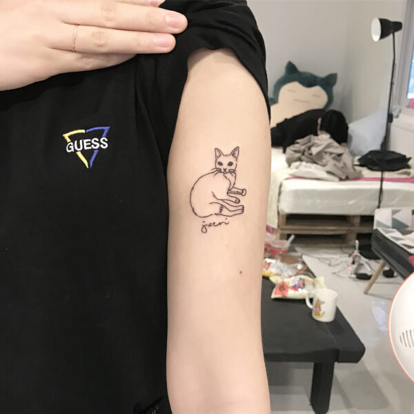 Illustrative Cat Upper Arm Tattoo
