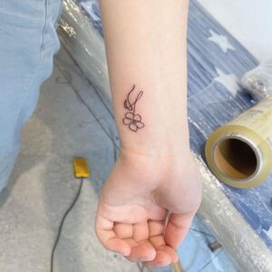Flowing Flower Wrist Tattoo