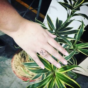Letter H Script Finger Tattoo