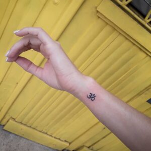 Om Symbol Wrist Tattoo