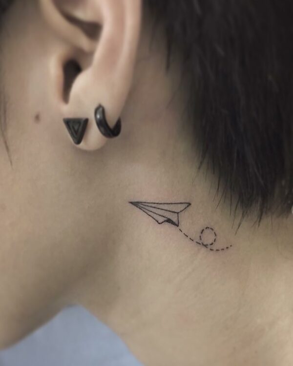 Paper Airplane Behind the Ear Tattoo