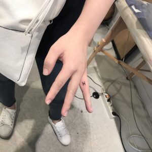 Pisces Symbol Finger Tattoo