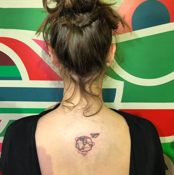 Paper Airplane Circling the World Upper Back Tattoo